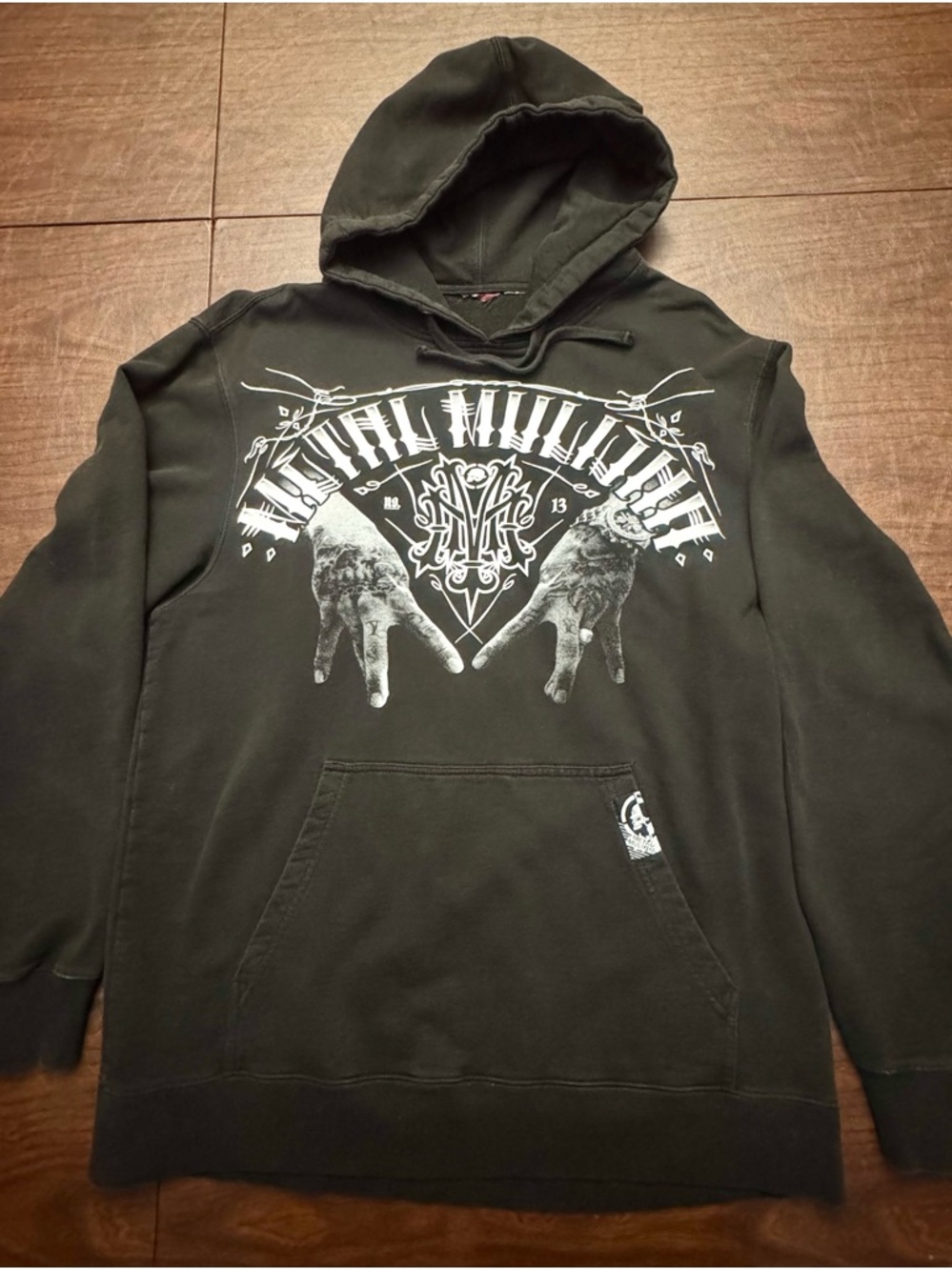 Metal Mulisha hoody with chest and back graphics.